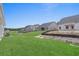 View of the spacious backyard with newly laid sod, offering ample space for outdoor activities at 1204 Nw Calabash Station Blvd., Calabash, NC 28467