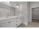 Bathroom featuring double vanity, walk-in closet, and modern finishes at 1204 Nw Calabash Station Blvd., Calabash, NC 28467