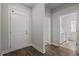 Bright entryway with a white front door and views into a bathroom at 1204 Nw Calabash Station Blvd., Calabash, NC 28467