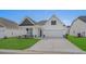 Charming one-story home with white siding, a two-car garage, and a well-manicured lawn at 1204 Nw Calabash Station Blvd., Calabash, NC 28467