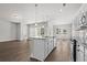 Spacious kitchen island with sink and seating area, flowing into the living space at 1204 Nw Calabash Station Blvd., Calabash, NC 28467