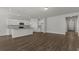 Modern kitchen with white cabinets, an island with granite countertops, and stainless steel appliances at 1204 Nw Calabash Station Blvd., Calabash, NC 28467