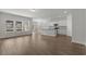 A bright, open-concept living area with hardwood floors and a modern kitchen at 1204 Nw Calabash Station Blvd., Calabash, NC 28467