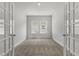 An open office space featuring neutral carpet, French doors and lots of natural light at 1204 Nw Calabash Station Blvd., Calabash, NC 28467