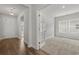 A cozy office space bathed in natural light, featuring neutral carpet and glass French doors at 1204 Nw Calabash Station Blvd., Calabash, NC 28467