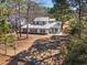 An aerial view of the home showcases its placement among mature trees at 144 Springfield Rd., Pawleys Island, SC 29585