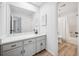 Bathroom featuring gray cabinets with black hardware, new floors, and ensuite access from bedroom at 144 Springfield Rd., Pawleys Island, SC 29585