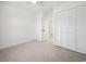 Neutral bedroom featuring carpet, a ceiling fan, a closet, and a white paint at 144 Springfield Rd., Pawleys Island, SC 29585