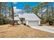 Charming single-story home featuring a light gray exterior, metal roof, and a well-maintained front yard at 144 Springfield Rd., Pawleys Island, SC 29585
