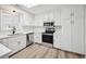 Bright kitchen with white cabinetry, stainless steel appliances, and modern finishes at 144 Springfield Rd., Pawleys Island, SC 29585