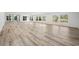 Bright living room featuring wood floors, recessed lighting, and many windows providing natural light at 144 Springfield Rd., Pawleys Island, SC 29585