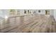 Bright living room featuring wood floors, recessed lighting, and many windows providing natural light at 144 Springfield Rd., Pawleys Island, SC 29585