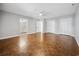 Spacious main bedroom features parquet floors, a ceiling fan, double closets, and ensuite access to a bathroom at 144 Springfield Rd., Pawleys Island, SC 29585