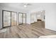Open sunroom with sliding glass doors, white walls, and wood floors at 144 Springfield Rd., Pawleys Island, SC 29585