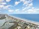 Picturesque aerial view showcasing the coastline, beach, and surrounding waterfront community at 1581 S Waccamaw Dr. # 402, Garden City Beach, SC 29576