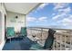 Cozy balcony with comfortable seating offering breathtaking ocean views on a sunny day at 1581 S Waccamaw Dr. # 402, Garden City Beach, SC 29576