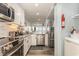 Efficient kitchen featuring stainless steel appliances, granite countertops, and seamless kitchen living at 1581 S Waccamaw Dr. # 402, Garden City Beach, SC 29576