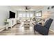 Cozy living room featuring stylish furnishings and sliding doors to the balcony with beach views at 1581 S Waccamaw Dr. # 402, Garden City Beach, SC 29576