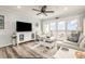 Comfortable living space with a TV, and sliding doors to a relaxing balcony with ocean views at 1581 S Waccamaw Dr. # 402, Garden City Beach, SC 29576