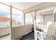 Enclosed porch featuring comfortable seating and views of the beach and ocean at 1581 S Waccamaw Dr. # 402, Garden City Beach, SC 29576