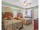 Comfortable guest bedroom features two twin beds, a desk, and soft lighting for a cozy atmosphere at 1706 S Ocean Blvd. # 1001, North Myrtle Beach, SC 29582
