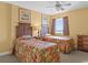 Inviting bedroom featuring two beds, a ceiling fan and an accent wall with tasteful decorations at 1706 S Ocean Blvd. # 1001, North Myrtle Beach, SC 29582