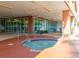 Comfortable indoor hot tub area with seating and views of the pool and lounging areas at 1706 S Ocean Blvd. # 1001, North Myrtle Beach, SC 29582