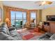 Spacious living area with comfortable seating, ocean views, and cozy decor at 1706 S Ocean Blvd. # 1001, North Myrtle Beach, SC 29582
