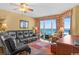 Relax in this cozy living room with ocean views from floor-to-ceiling windows at 1706 S Ocean Blvd. # 1001, North Myrtle Beach, SC 29582