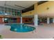 Indoor pool area with inviting blue water, a lower level gym, and ample space for relaxation at 1706 S Ocean Blvd. # 1001, North Myrtle Beach, SC 29582