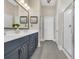 Bathroom with tile flooring, double sinks, and a glass shower at 2005 Silver Island Way, Murrells Inlet, SC 29576