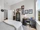 Bedroom featuring desk, display cabinet and connecting bathroom at 2005 Silver Island Way, Murrells Inlet, SC 29576