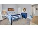 Bright bedroom showcasing a blue dresser, decor, and inviting bedding at 2005 Silver Island Way, Murrells Inlet, SC 29576