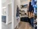 Walk-in closet with built-in shelving and carpet flooring next to the bathroom at 2005 Silver Island Way, Murrells Inlet, SC 29576