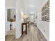 Bright entryway hallway with luxury vinyl plank flooring and stylish console tables at 2005 Silver Island Way, Murrells Inlet, SC 29576
