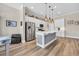 Bright kitchen with stainless steel appliances, an island with sink, and modern pendant lighting at 2005 Silver Island Way, Murrells Inlet, SC 29576