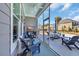 Screened-in patio with comfortable seating area and view of the pool at 2005 Silver Island Way, Murrells Inlet, SC 29576