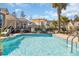 Sun-drenched pool area with a clean, refreshing pool and lounge seating surrounded by tropical landscaping at 2005 Silver Island Way, Murrells Inlet, SC 29576