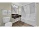 Compact bathroom featuring standard toilet and tub/shower, along with a compact vanity at 201 74Th Ave. N # 703, Myrtle Beach, SC 29572