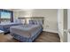 This bedroom offers two beds adorned with neutral-toned quilts and wood-look flooring at 201 74Th Ave. N # 703, Myrtle Beach, SC 29572
