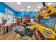 Spacious game room featuring race car games, a basketball arcade, and a seating area at 201 74Th Ave. N # 703, Myrtle Beach, SC 29572