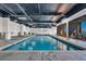 Large indoor pool features a 3ft depth and multiple lounge chairs and floor-to-ceiling views at 201 74Th Ave. N # 703, Myrtle Beach, SC 29572