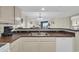 Kitchen with stainless sink with a breakfast bar overlooking the living area at 201 74Th Ave. N # 703, Myrtle Beach, SC 29572