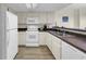A well-maintained kitchen features essential appliances and ample counter space at 201 74Th Ave. N # 703, Myrtle Beach, SC 29572