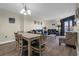 Open-plan living room with dining area and balcony access in neutral tones at 201 74Th Ave. N # 703, Myrtle Beach, SC 29572