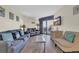 Cozy living room with comfortable sofas, a TV, and access to a balcony with ocean views at 201 74Th Ave. N # 703, Myrtle Beach, SC 29572