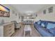Open-concept living room with lots of light and open access to the kitchen and dining area at 201 74Th Ave. N # 703, Myrtle Beach, SC 29572