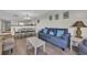 Living room with sofas, coffee table and open floorplan to dining and kitchen areas at 201 74Th Ave. N # 703, Myrtle Beach, SC 29572