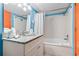 Well-lit bathroom featuring granite-topped vanity, soaking tub, and shower with curtain at 201 S Ocean Blvd. # 217, Myrtle Beach, SC 29577