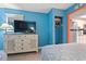 The bedroom features a TV, closet, and leads into a fully equipped kitchen at 201 S Ocean Blvd. # 217, Myrtle Beach, SC 29577